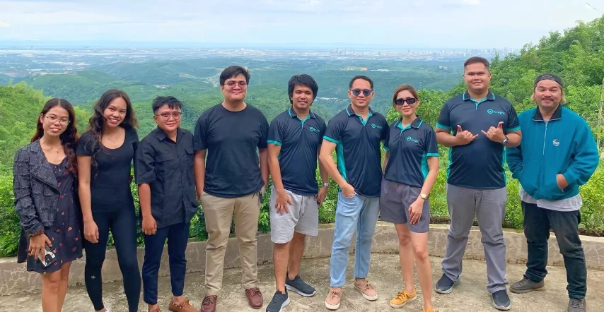 Future-Proofing Your Business: A Digital Marketing Roadmap for 2025 7 A photo of the Ensight Digital Marketing Team, featuring a group of individuals in uniform shirt, all smiling together.