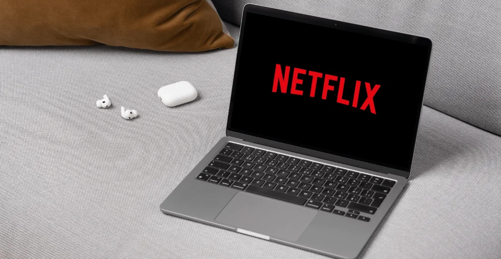 Future-Proofing Your Business: A Digital Marketing Roadmap for 2025 2 The image shows a laptop open with the Netflix logo prominently displayed on its screen.